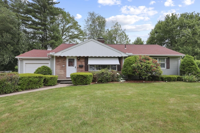 32 Butternut Ridge Rd, Waterbury, CT 06706 - view of front facade with a chimney, an attached garage, and a front yard