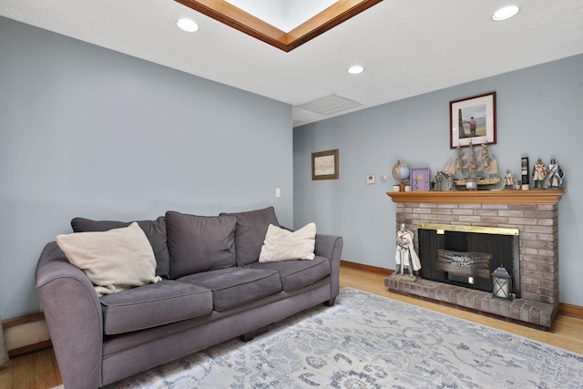32 Butternut Ridge Rd, Waterbury, CT 06706 - living area with wood finished floors, recessed lighting, and a fireplace