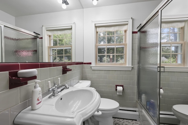 32 Butternut Ridge Rd, Waterbury, CT 06706 - bathroom with tile walls, a baseboard heating unit, a stall shower, and baseboard heating