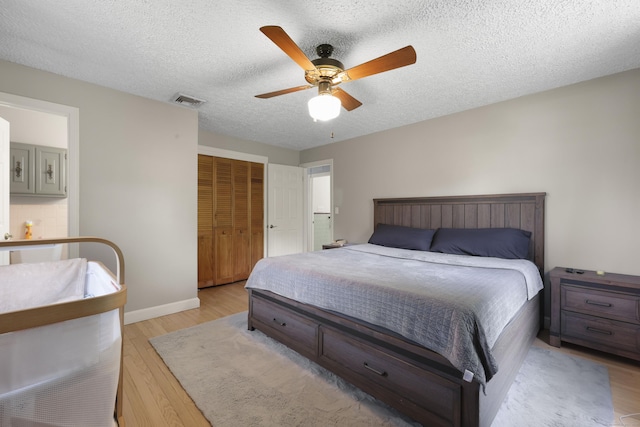 32 Butternut Ridge Rd, Waterbury, CT 06706 - bedroom featuring light wood-style floors, a closet, a ceiling fan, and a textured ceiling