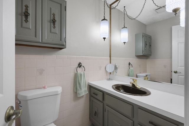 32 Butternut Ridge Rd, Waterbury, CT 06706 - bathroom with tile walls, vanity, and a wainscoted wall