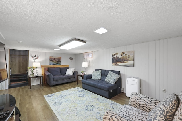 32 Butternut Ridge Rd, Waterbury, CT 06706 - living area with wood finished floors and a textured ceiling