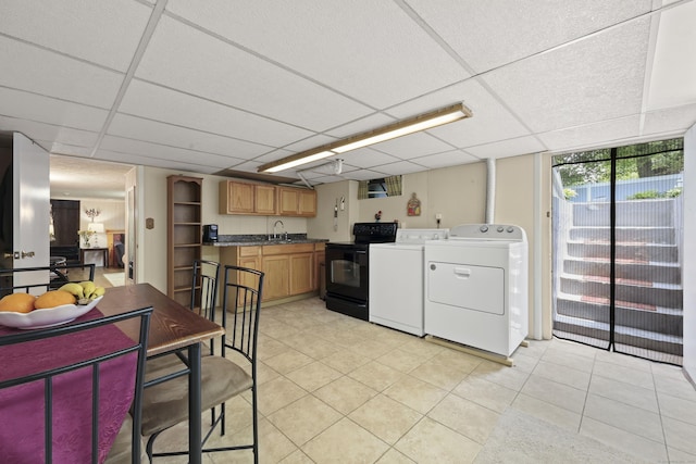 32 Butternut Ridge Rd, Waterbury, CT 06706 - kitchen with black electric range oven, independent washer and dryer, light tile patterned flooring, a paneled ceiling, and dark countertops