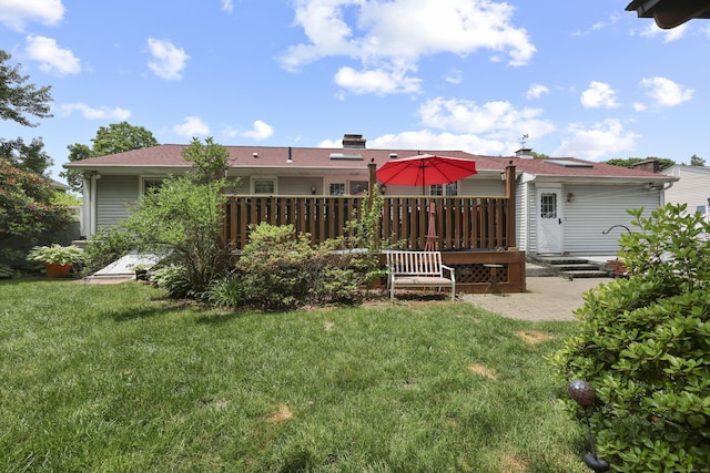 32 Butternut Ridge Rd, Waterbury, CT 06706 - rear view of house with a deck, a lawn, and a patio