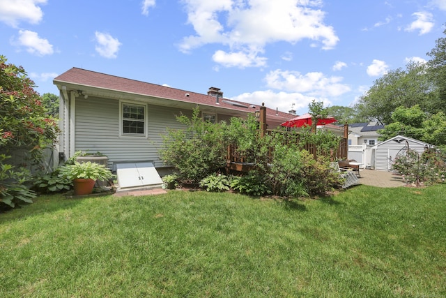 32 Butternut Ridge Rd, Waterbury, CT 06706 - back of house with a storage unit and a yard