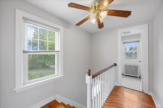 630 French St, Watertown, CT 06779 - stairs featuring radiator, wood finished floors, and a ceiling fan