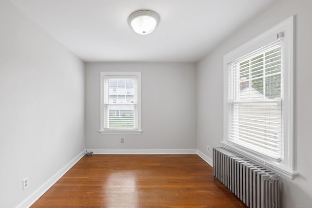 630 French St, Watertown, CT 06779 - empty room with radiator and wood finished floors