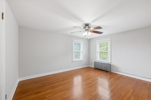 630 French St, Watertown, CT 06779 - spare room with radiator, wood finished floors, and a ceiling fan