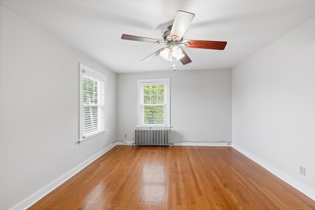 630 French St, Watertown, CT 06779 - spare room with radiator heating unit, wood finished floors, and ceiling fan