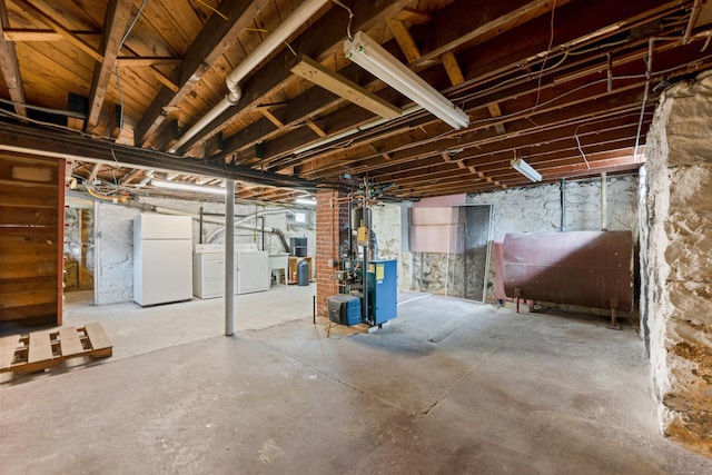630 French St, Watertown, CT 06779 - unfinished basement with heating fuel, freestanding refrigerator, independent washer and dryer, and a heating unit
