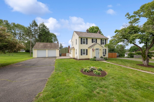 630 French St, Watertown, CT 06779 - colonial-style house with a detached garage, a chimney, an outdoor structure, and a front yard