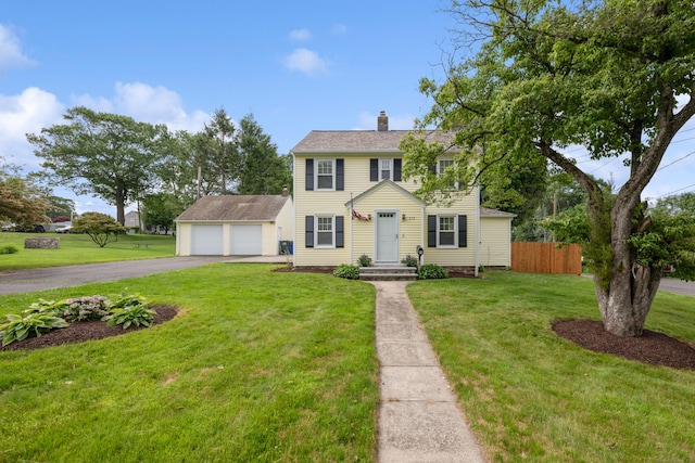 630 French St, Watertown, CT 06779 - colonial-style house with a chimney, a garage, driveway, and an outdoor structure