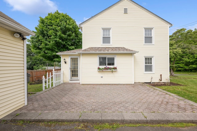 630 French St, Watertown, CT 06779 - rear view of house with a patio area and roof with shingles