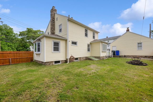 630 French St, Watertown, CT 06779 - rear view of property with an outdoor fire pit and a chimney