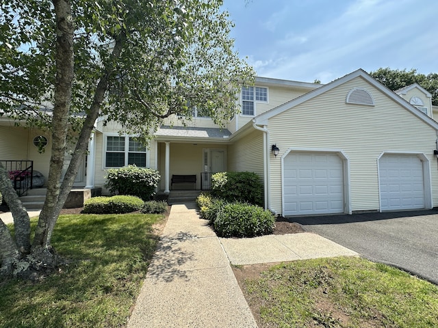 202 The Mews Unit 202, Rocky Hill, CT 06067 - view of front of property with asphalt driveway, an attached garage, and a porch