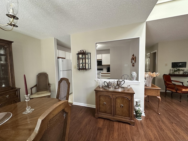 202 The Mews Unit 202, Rocky Hill, CT 06067 - dining space featuring wood finished floors and a textured ceiling