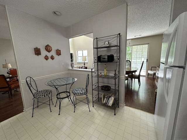 202 The Mews Unit 202, Rocky Hill, CT 06067 - dining room with a textured ceiling and wood finished floors