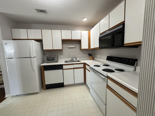 202 The Mews Unit 202, Rocky Hill, CT 06067 - kitchen with white appliances, light countertops, white cabinetry, and a textured ceiling