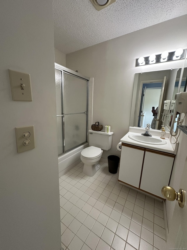202 The Mews Unit 202, Rocky Hill, CT 06067 - bathroom with vanity, shower / bath combination with glass door, tile patterned floors, and a textured ceiling