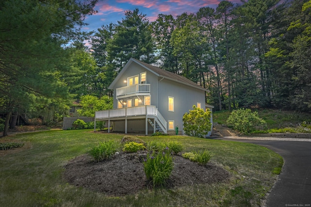 5 Hemlock Notch St, Farmington, CT 06085 - property exterior at dusk featuring a balcony, stairway, and a lawn