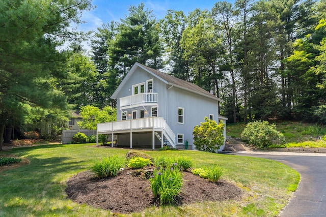 5 Hemlock Notch St, Farmington, CT 06085 - rear view of house featuring stairway, a balcony, a lawn, roof with shingles, and view of scattered trees