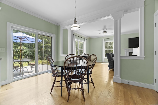257 Ichabod Rd, Southbury, CT 06488 - dining area featuring ornate columns, light wood-style flooring, crown molding, and ceiling fan