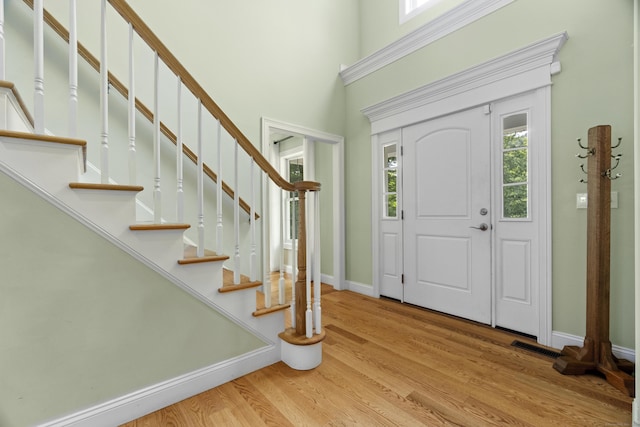 257 Ichabod Rd, Southbury, CT 06488 - foyer featuring wood finished floors, a towering ceiling, and stairway