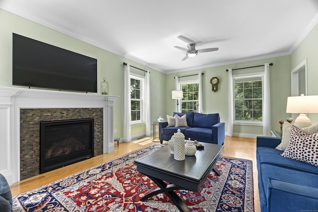 257 Ichabod Rd, Southbury, CT 06488 - living room featuring ceiling fan, wood finished floors, ornamental molding, and a glass covered fireplace