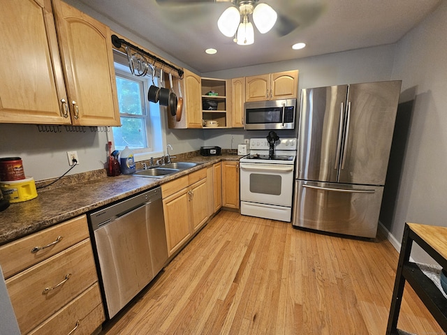 15 Clark Hill Rd, Prospect, CT 06712 - kitchen with stainless steel appliances, light wood finished floors, dark countertops, light brown cabinets, and recessed lighting