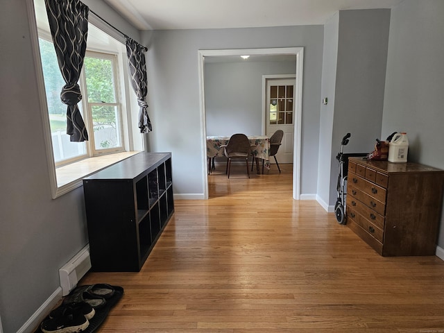 15 Clark Hill Rd, Prospect, CT 06712 - hallway with light wood finished floors and a baseboard heating unit