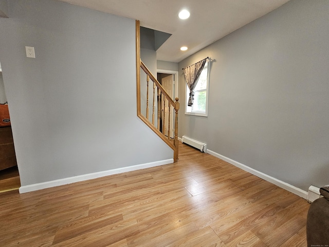 15 Clark Hill Rd, Prospect, CT 06712 - spare room with a baseboard radiator, stairway, recessed lighting, and light wood-type flooring
