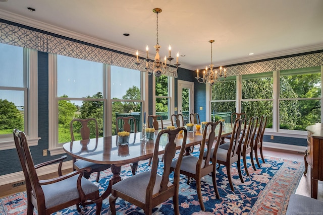77 E Wharf Rd, Madison, CT 06443 - dining space featuring a chandelier, ornamental molding, plenty of natural light, and wood finished floors
