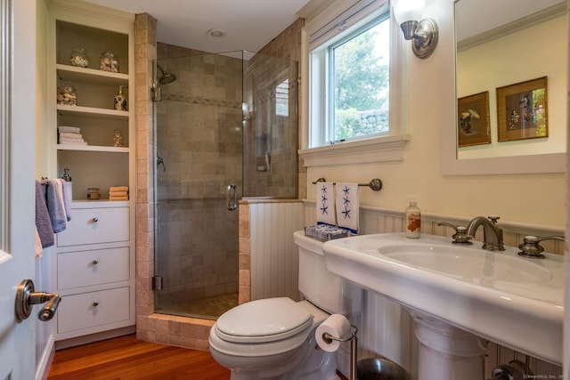 77 E Wharf Rd, Madison, CT 06443 - bathroom with a stall shower, wood finished floors, and wainscoting