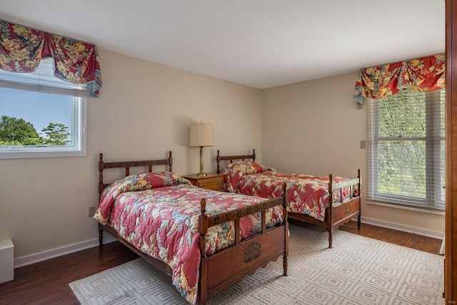 77 E Wharf Rd, Madison, CT 06443 - bedroom with multiple windows and wood finished floors
