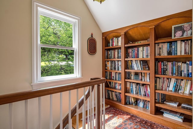 77 E Wharf Rd, Madison, CT 06443 - hallway featuring healthy amount of natural light, vaulted ceiling, and wood finished floors