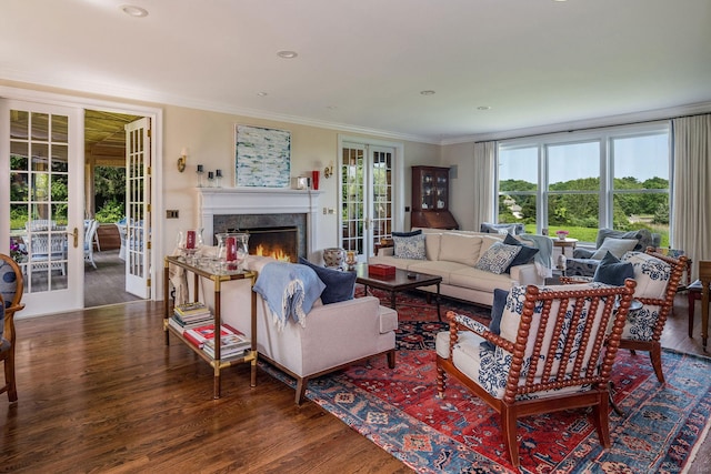 77 E Wharf Rd, Madison, CT 06443 - living area with french doors, wood finished floors, healthy amount of natural light, a fireplace, and ornamental molding