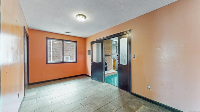 167 George St, Hartford, CT 06114 - empty room featuring baseboards and a textured ceiling
