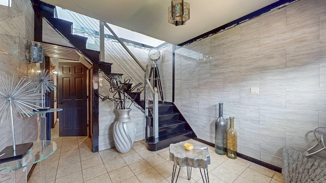 167 George St, Hartford, CT 06114 - staircase featuring tile patterned flooring and tile walls