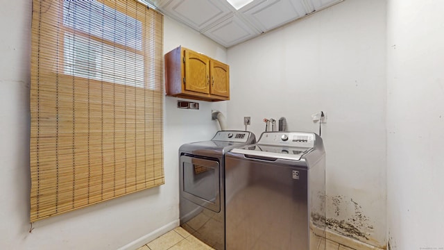 167 George St, Hartford, CT 06114 - laundry room featuring cabinet space, washing machine and clothes dryer, and light tile patterned floors
