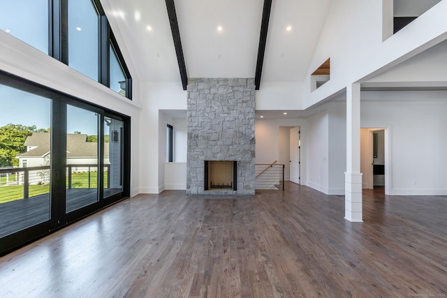 103 Chalybes Rd W, Roxbury, CT 06783 - unfurnished living room with high vaulted ceiling, wood finished floors, beam ceiling, a fireplace, and recessed lighting