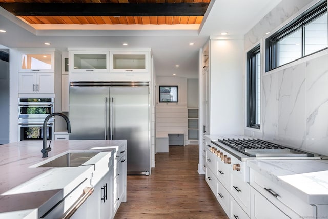 103 Chalybes Rd W, Roxbury, CT 06783 - kitchen featuring stainless steel appliances, wood ceiling, white cabinets, light stone countertops, and glass insert cabinets