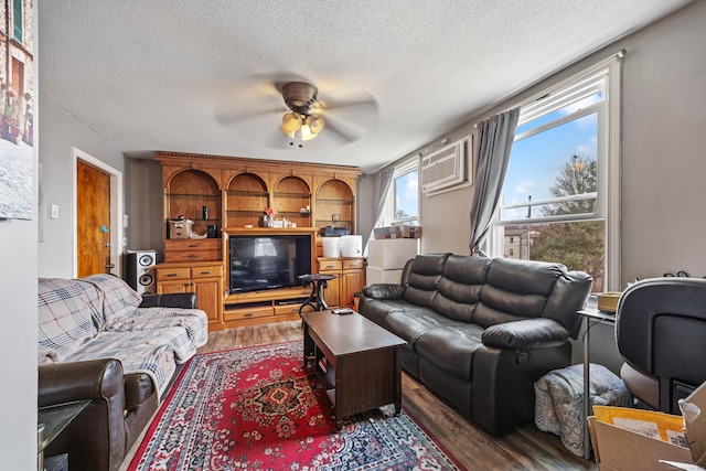 52 Irving St Apt 4, Bristol, CT 06010 - living area with wood finished floors, ceiling fan, and a textured ceiling