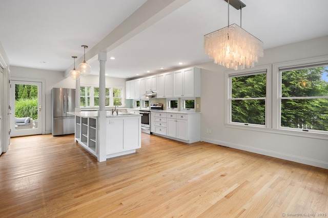 19 Sherwood Dr, Westport, CT 06880 - kitchen featuring appliances with stainless steel finishes, healthy amount of natural light, light countertops, and recessed lighting