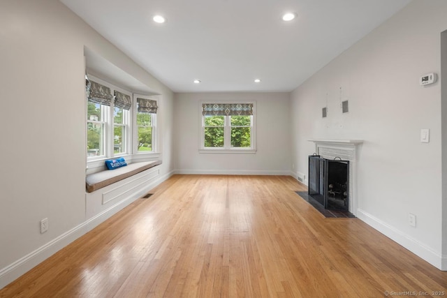 19 Sherwood Dr, Westport, CT 06880 - unfurnished living room with light wood-type flooring, a fireplace with flush hearth, and recessed lighting