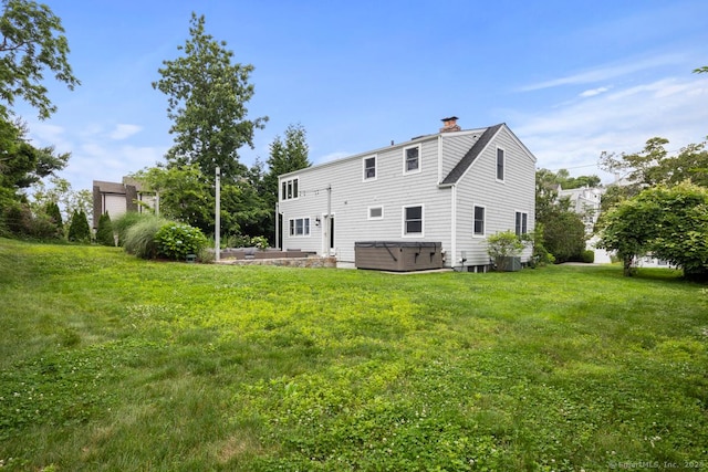 19 Sherwood Dr, Westport, CT 06880 - rear view of property featuring a hot tub, a chimney, and a yard