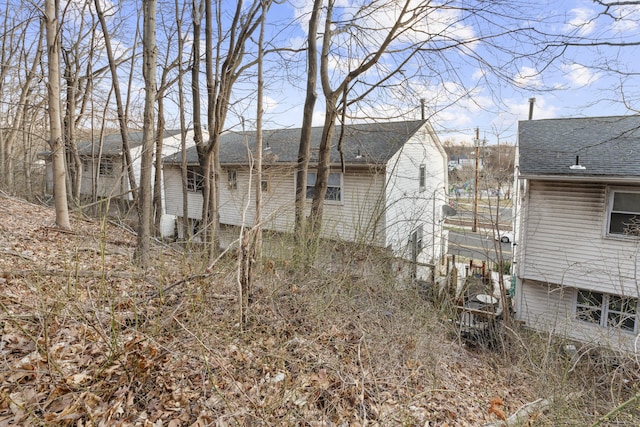 305 Mill Rock Rd Unit 305, Hamden, CT 06517 - back of property with roof with shingles