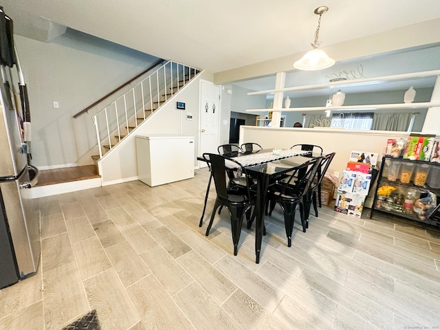 305 Mill Rock Rd Unit 305, Hamden, CT 06517 - dining space with light wood-style floors and stairs