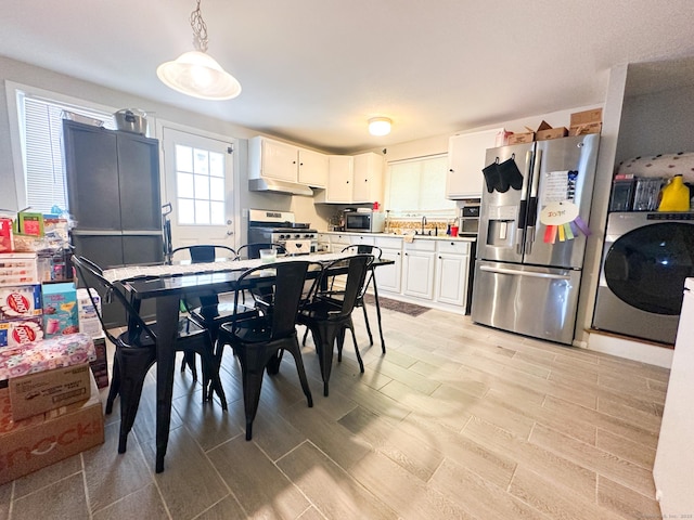 305 Mill Rock Rd Unit 305, Hamden, CT 06517 - dining space with washer / dryer and light wood-style floors