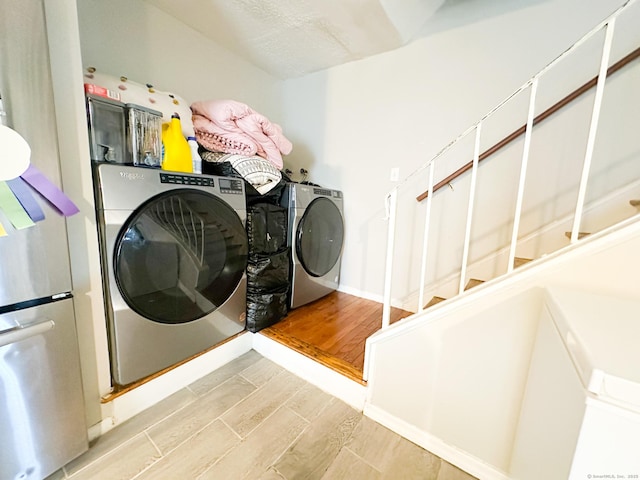 305 Mill Rock Rd Unit 305, Hamden, CT 06517 - washroom featuring washer and clothes dryer and wood finished floors