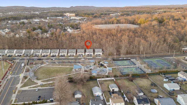 305 Mill Rock Rd Unit 305, Hamden, CT 06517 - aerial overview of property's location with a heavily wooded area and a mountainous background